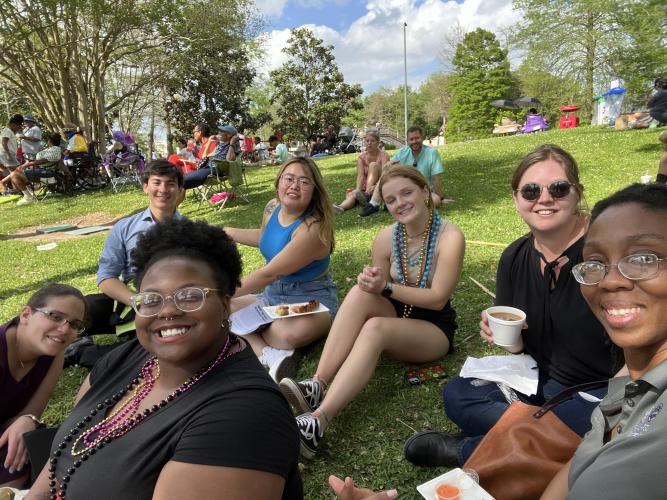 Gulf Scholars sitting together on the grass