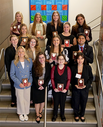 sai devulapalli with group of students holding plaques