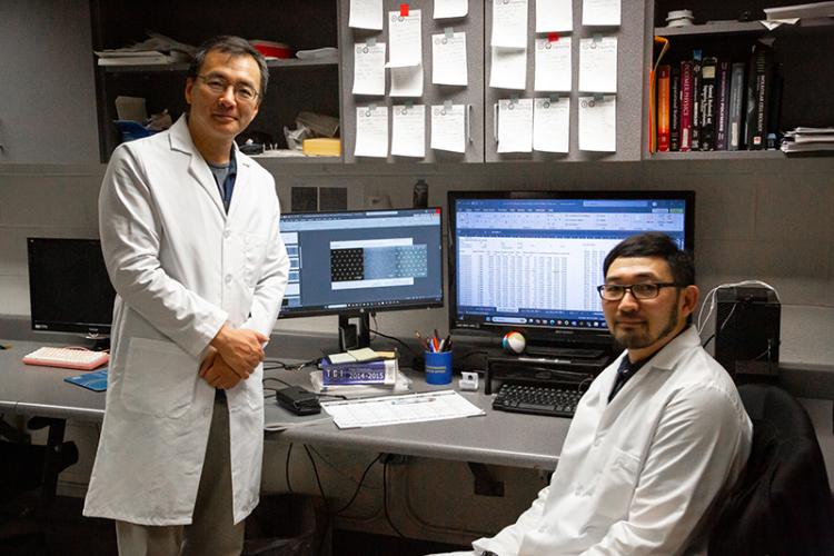 photo of famu-fsu engineering professor j guan and Masahiro Fukuda in the lab