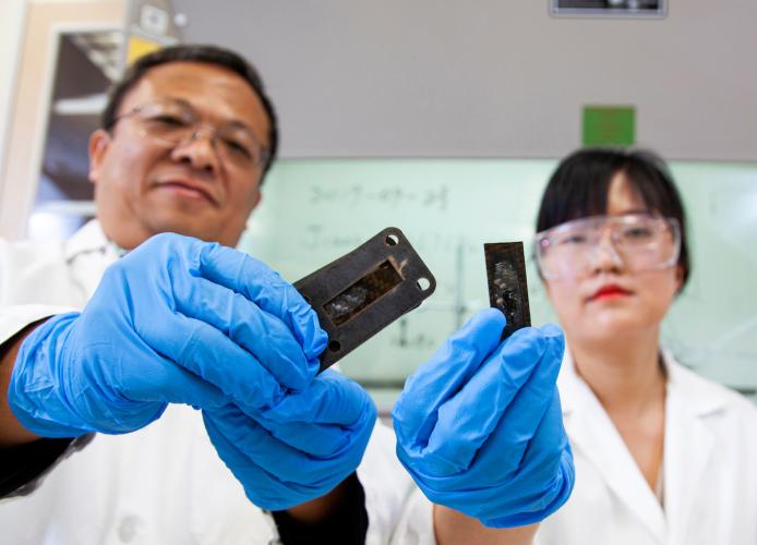 Dr. Richard Liang and a graduate student working in the lab