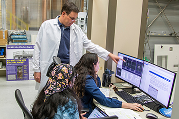 sam grant mag lab researcher with female grad students