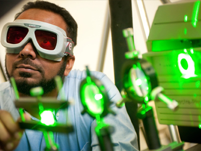 Student working with lasers