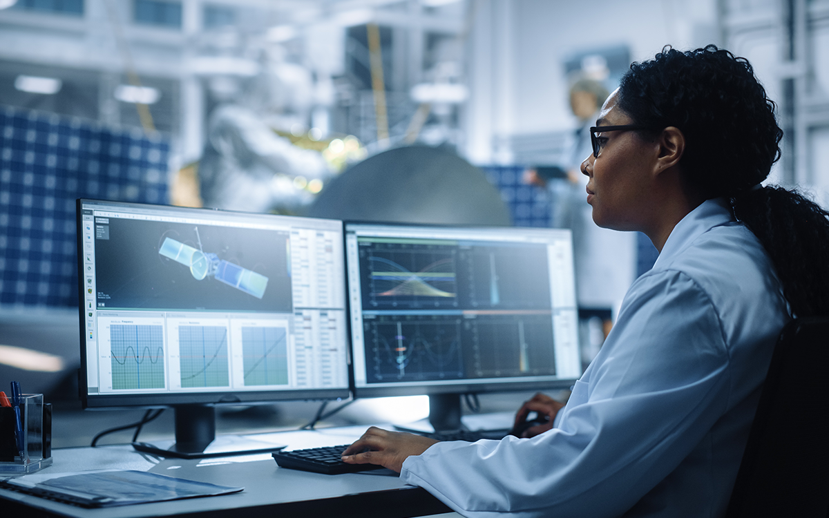 woman studying computer images at research center