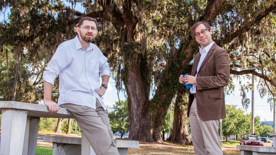 Professors Jonathan Clark, Ph.D., left, and Christian Hubicki Ph.D. outside their CISCOR lab at the FAMU-FSU College of Engineering in Tallahassee, Florida.