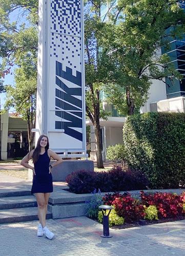 photo of lauren bishop in front of NIKE headquarters during her internship