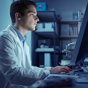 undergrad researcher in lab coat