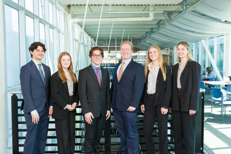 The six members of engineering senior design team 101 stand together on the third floor breezeway at the FAMU-FSU College of Engineering.
