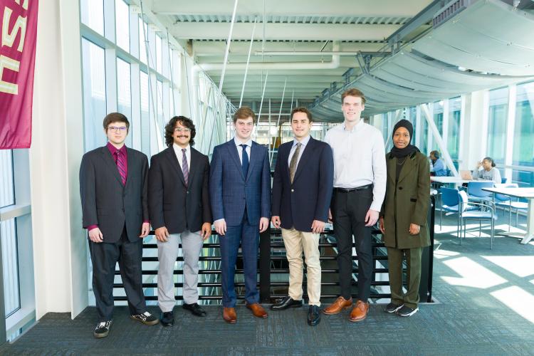 The six members of engineering senior design team 103 stand together on the third floor breezeway at the FAMU-FSU College of Engineering.
