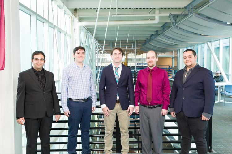 The five members of engineering senior design team 307 stand together on the third floor breezeway at the FAMU-FSU College of Engineering.