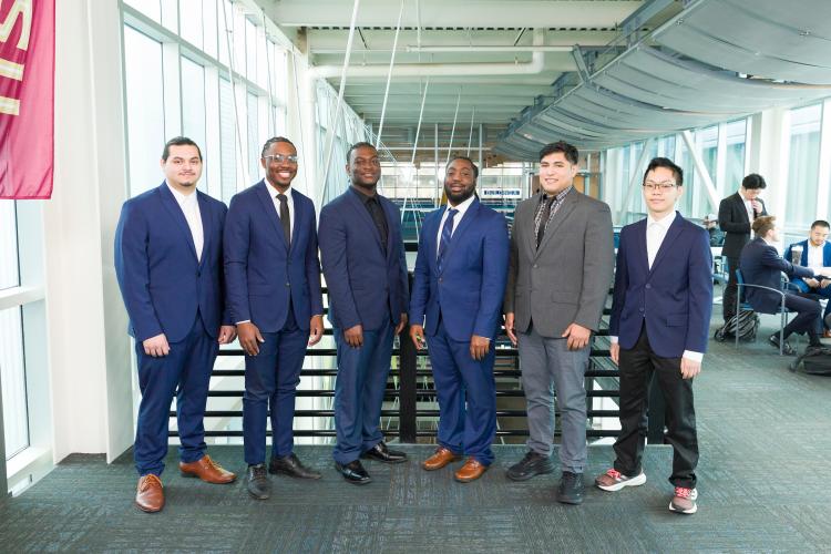 The six members of engineering senior design team 309 stand together on the third floor breezeway at the FAMU-FSU College of Engineering.