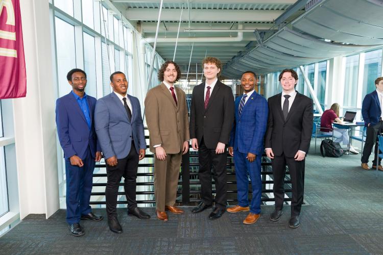 The six members of engineering senior design team 314 stand together on the third floor breezeway at the FAMU-FSU College of Engineering.