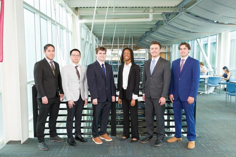 The six members of engineering senior design team 315 stand together on the third floor breezeway at the FAMU-FSU College of Engineering.