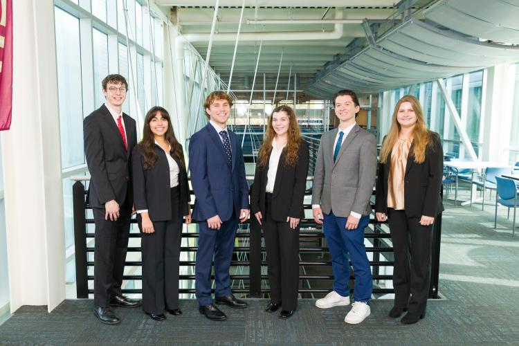 The six members of engineering senior design team 403 stand together on the third floor breezeway at the FAMU-FSU College of Engineering.