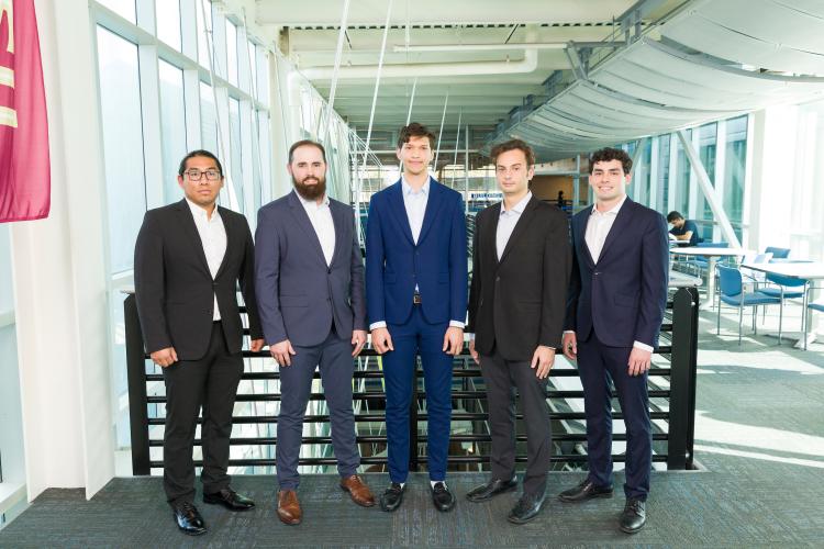 The five members of engineering senior design team 506 stand together on the third floor breezeway at the FAMU-FSU College of Engineering.