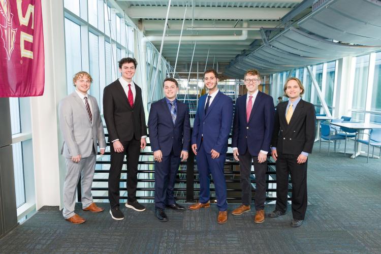 The six members of engineering senior design team 508 stand together on the third floor breezeway at the FAMU-FSU College of Engineering.