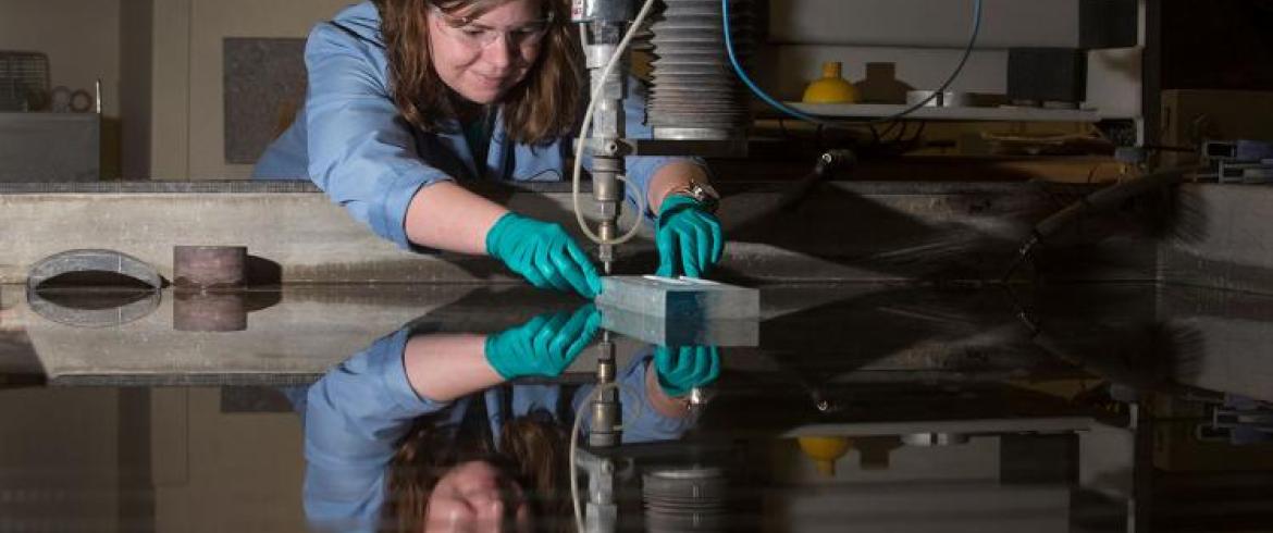 Female student fabricating utilizing