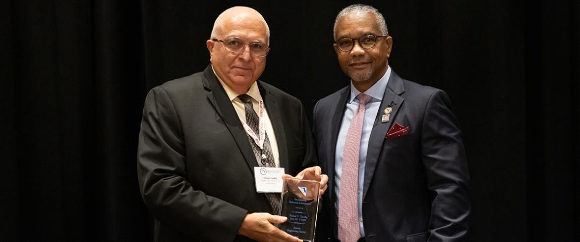 photo of dr kamal tawfiq recieving state FES award in july 2023