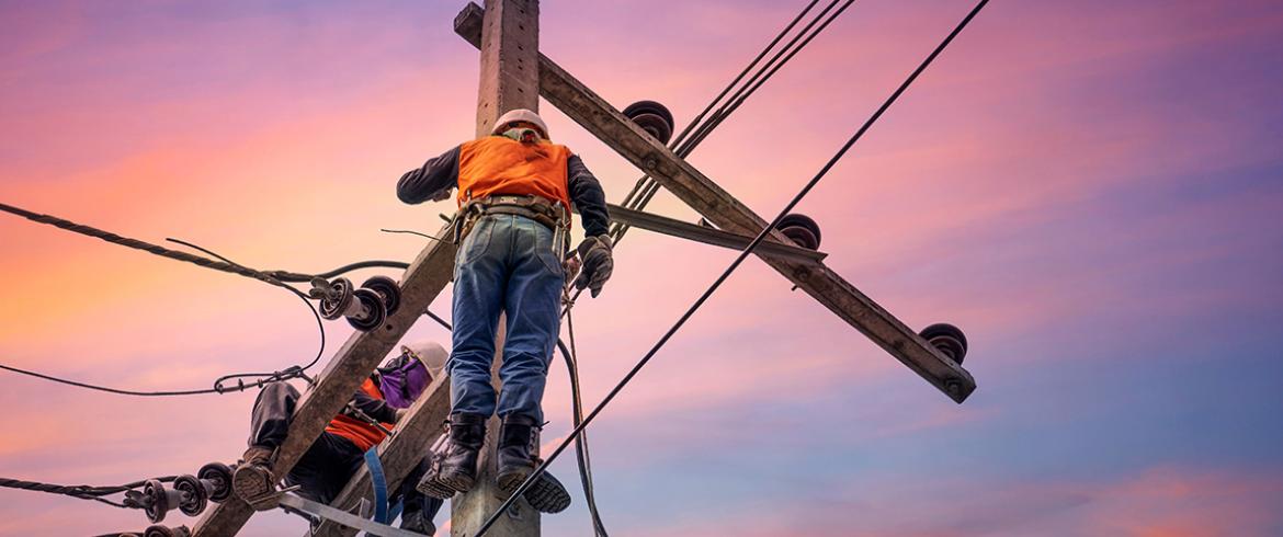 photo of linemen fixing power line