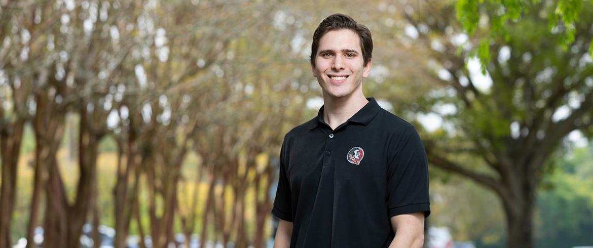 portrait of ben covitz in front of trees