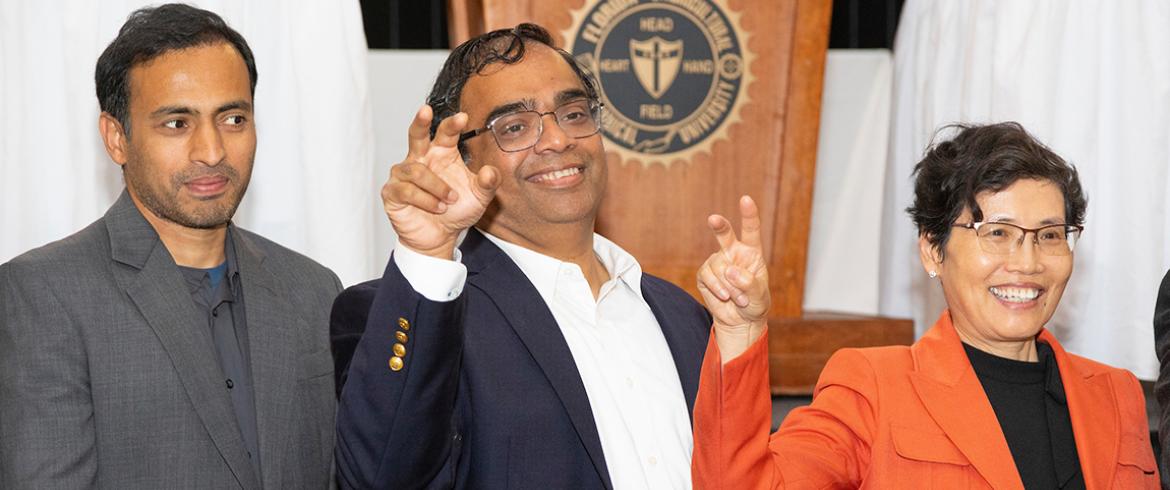 photo of three famu researchers making the strike again sign
