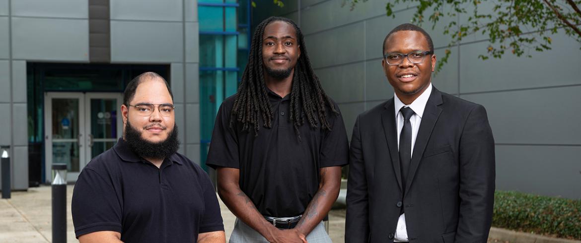 photo of three black engineering students standing in front of famu-fsu college of engineering
