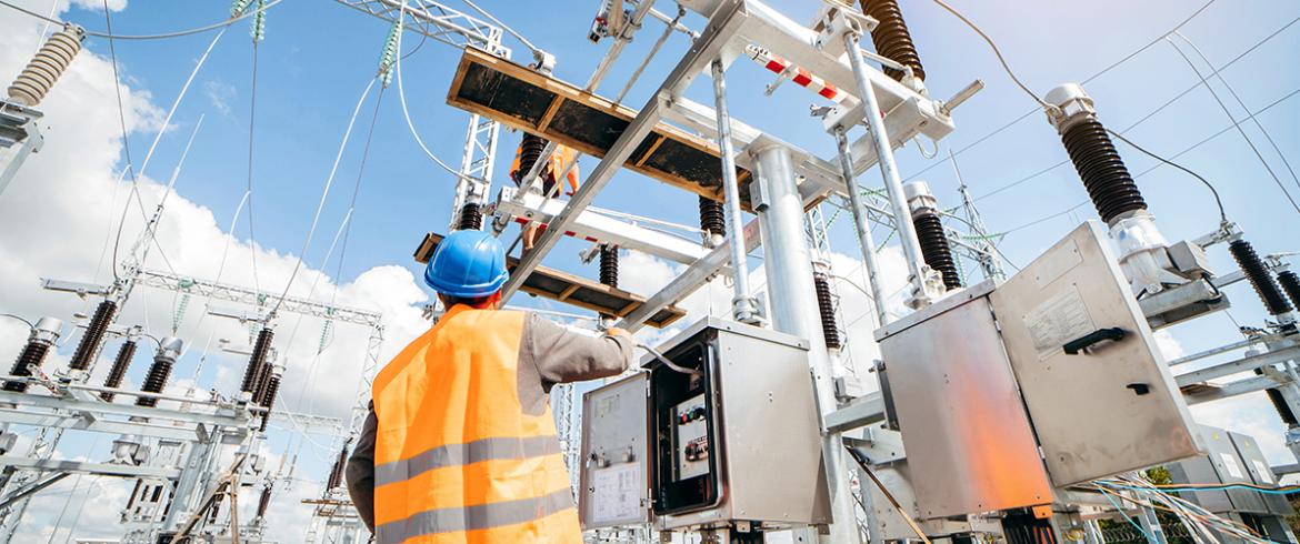 photo of electrical worker at substation