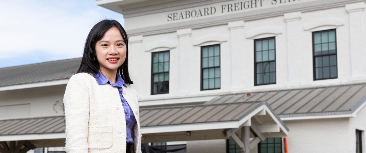 portrait of famu-fsu engineering faculty member vivian guo in front of train station