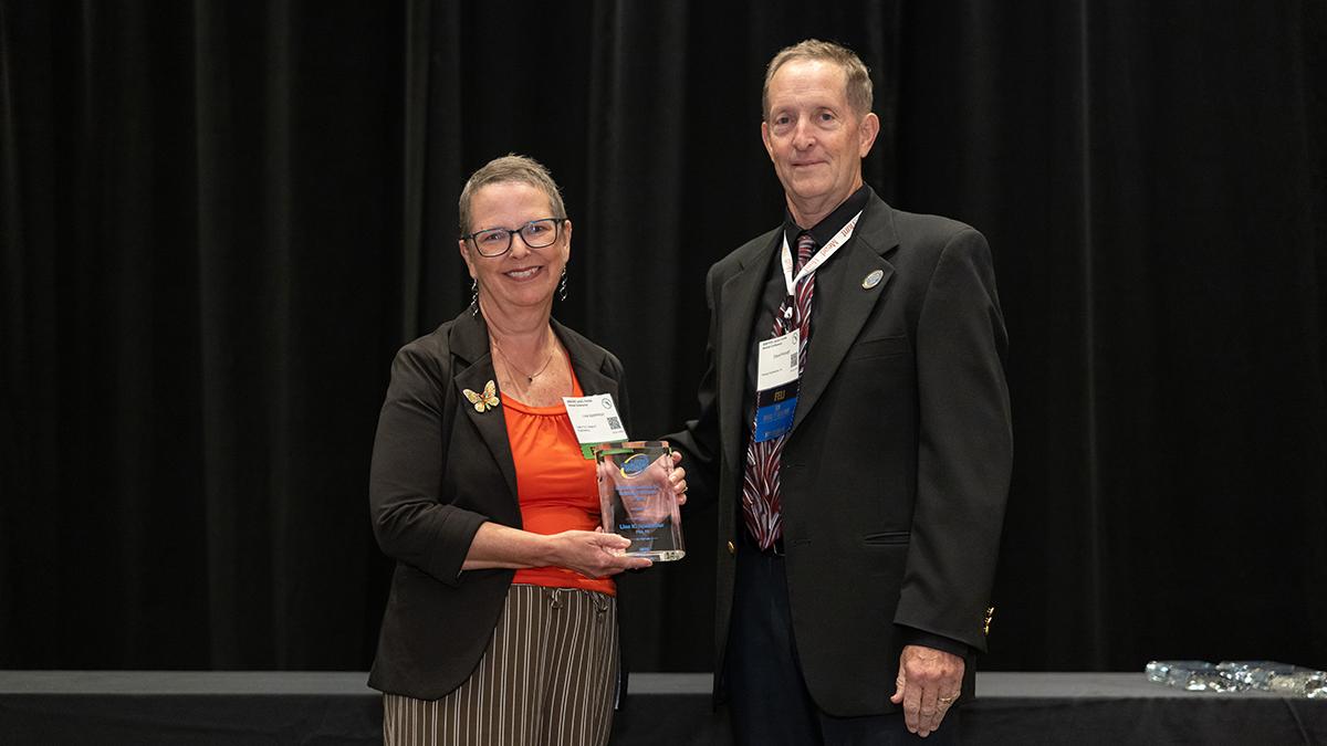photo of famu-fsu engineering professor lisa spainhour holding fes award