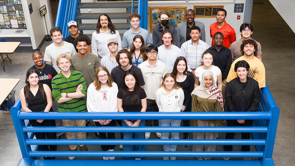 photo of engineering students on staircase landing
