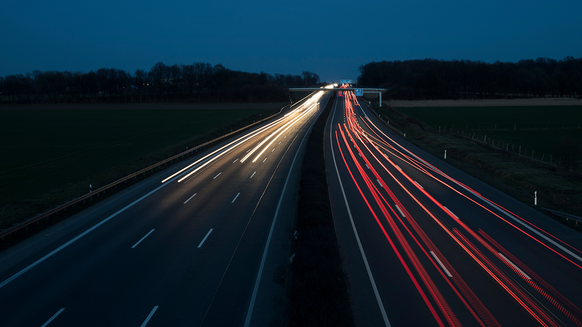 photo of car lights on highway at night blurred