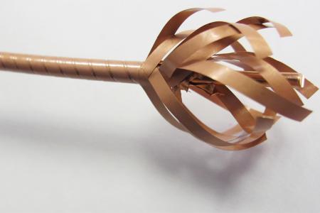 closeup photo of partially unwrapped brown wire with many layers weaved