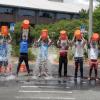Students dumping ice cold water over their heads