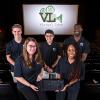 Virtual Lens Engineering Senior Design team with their prototype. The team members are: Weston Dudley, Kayla Miller, Daniella Turbessi, Kyle A. Suarez and Keishon Smith