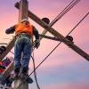 photo of linemen fixing power line