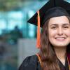 photo of lauren bishop in cap and gown in front of the famu-fsu college of engineering 