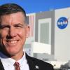 photo of famu-fsu engineering alumnus jeremy graeber in front of nasa launch building