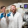 photo of daniel hallinan and michael patric blatt holding test tubes in lab at famu-fsu engineering