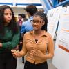 two black engineering students at a poster session at famu-fsu engineering