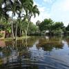 photo of flooded florida neighborhood with water over roadway