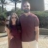 photo of couple wearing sunglasses outside embracing