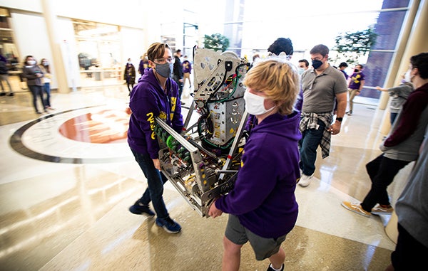 Team moving robot at FIRST Tallahassee Kickoff 2022