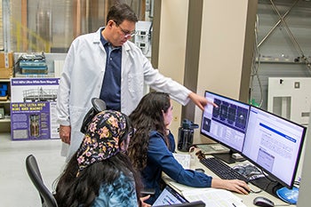 sam grant mag lab researcher with female grad students