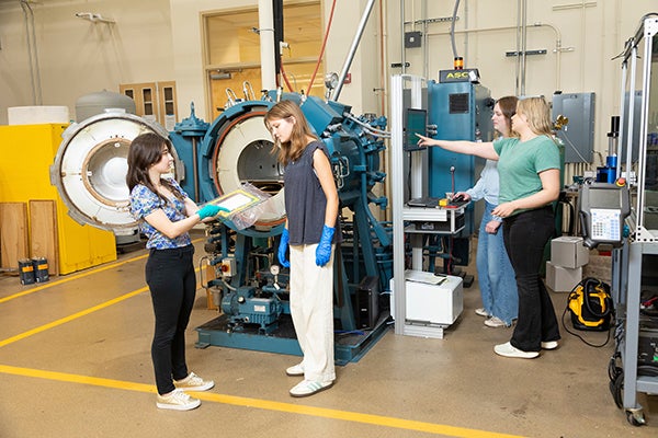 photo of famu-fsu engineering female grad students with two high school female engineering interns in the lab